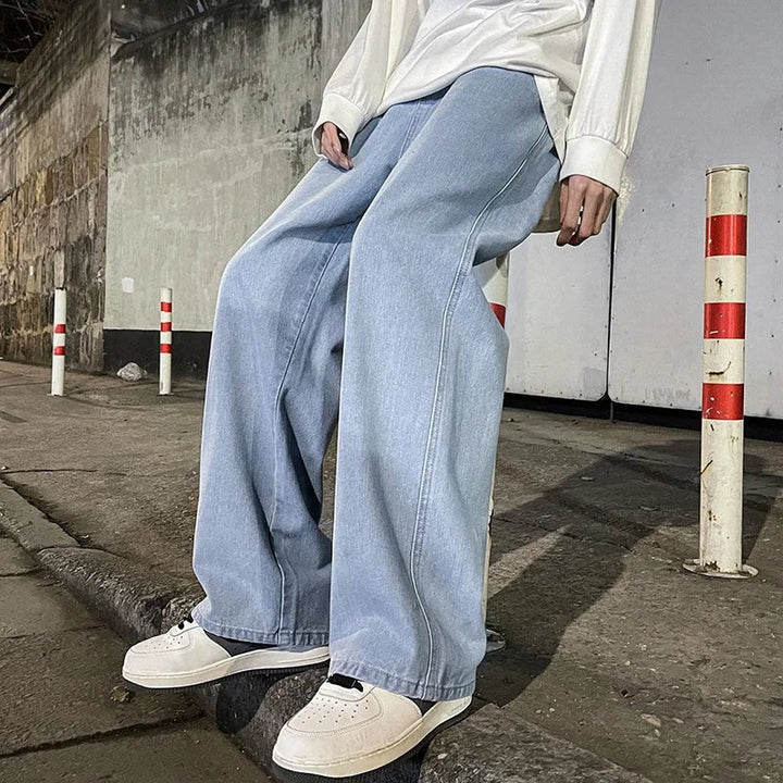 Men's relaxed wide-leg jeans, comfortable fit, blue denim pants for casual everyday style.