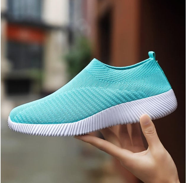 Women's comfortable slip-on sneakers. Easy-wear design for breathable, everyday casual footwear.