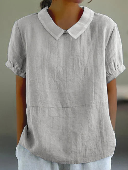 Versatile women's short sleeve blouse. Ideal for office wear, spring fashion, or everyday elegant style.