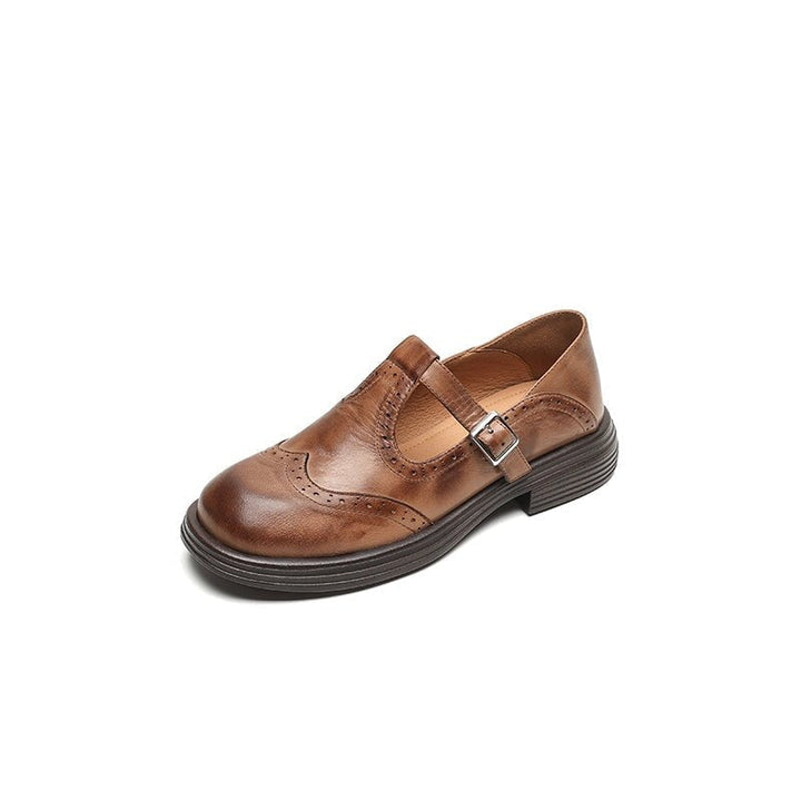 Vintage chic women's loafers with a stylish strap and buckle, offering comfort and timeless elegance.