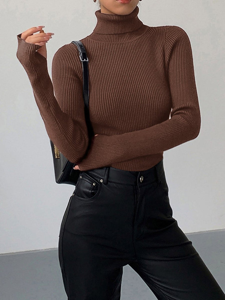 Close-up of a women's soft ribbed turtleneck knitwear, offering cozy warmth and elegant style.