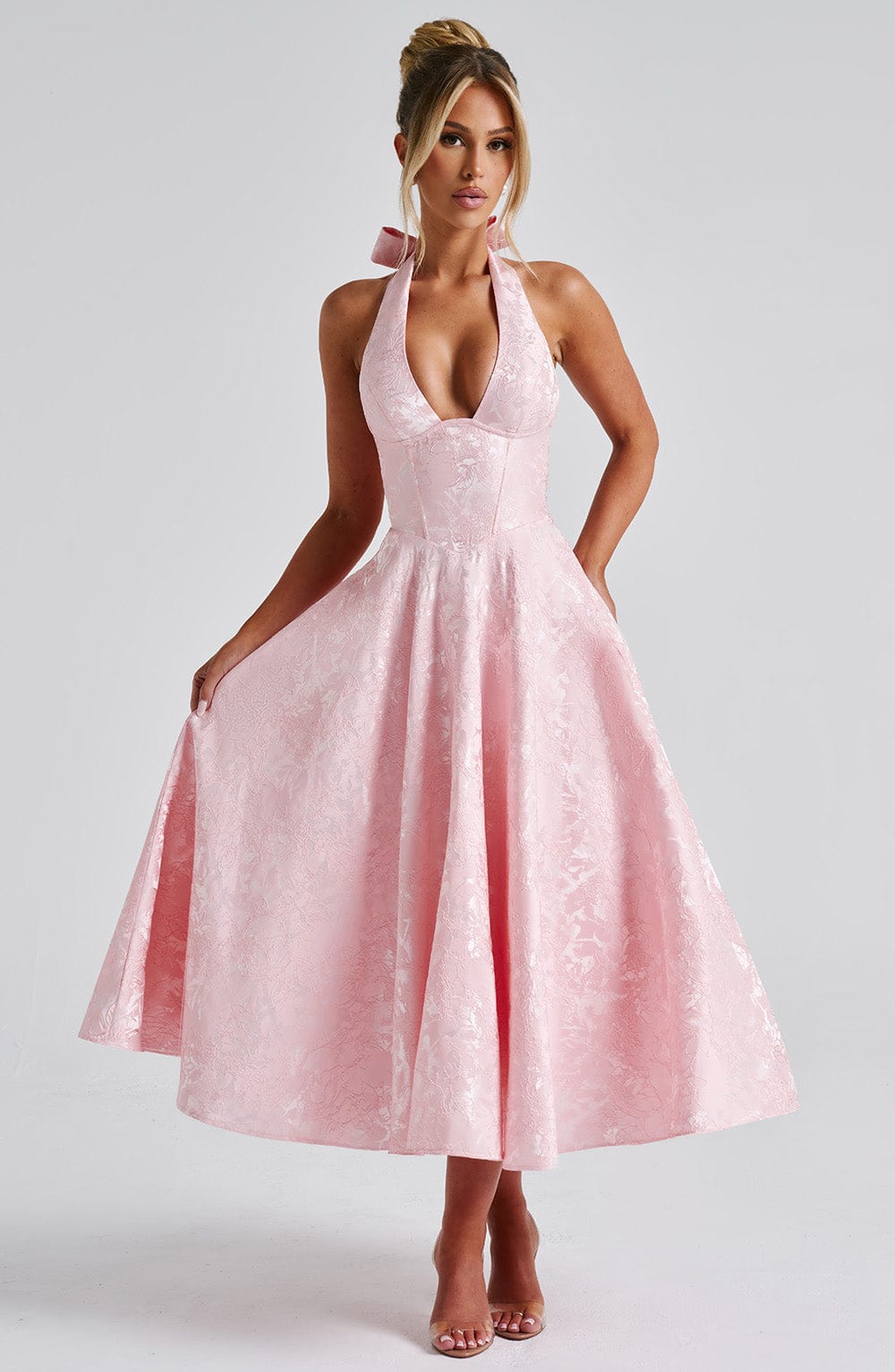 Elegant women's halter midi dress, perfect for a wedding guest or formal party attire.