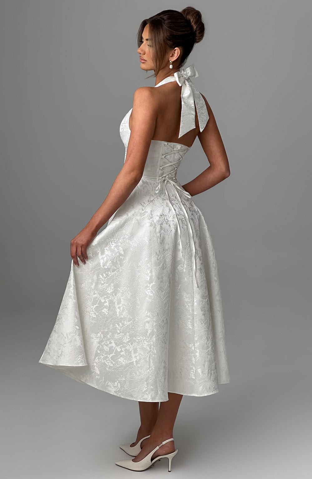 Sophisticated women's midi dress with halter neck, perfect for wedding guest or formal event.
