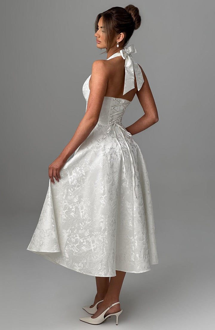 Sophisticated women's midi dress with halter neck, perfect for wedding guest or formal event.