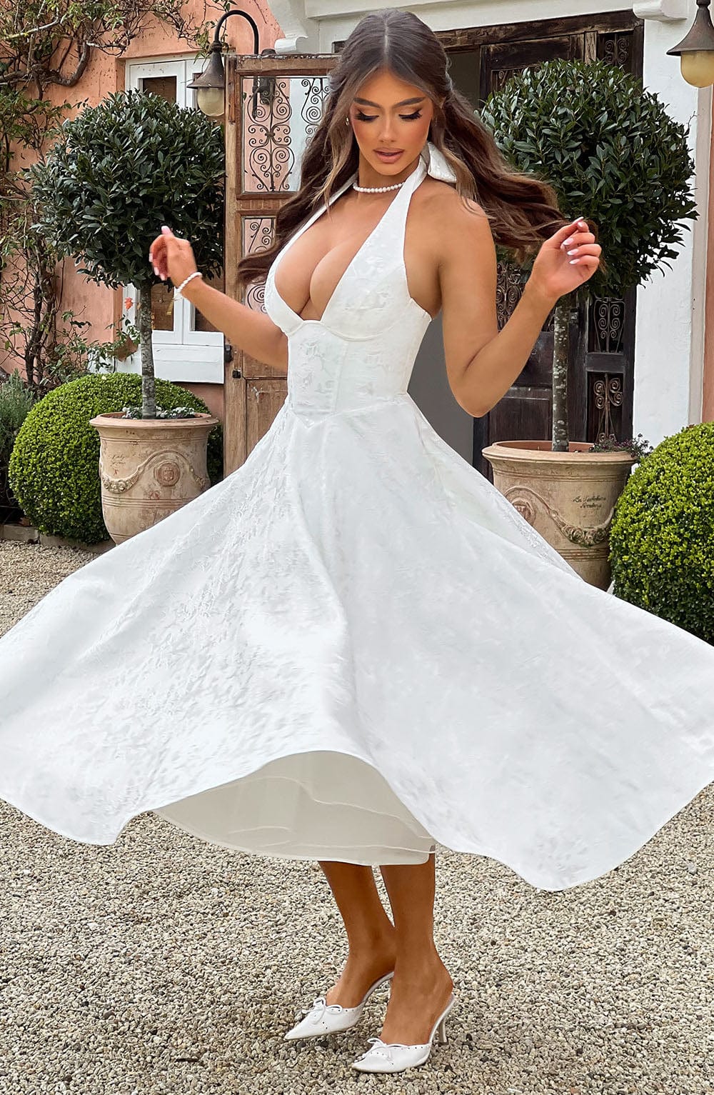 Beautiful women's halter midi dress, ideal for a wedding, cocktail party, or formal event.