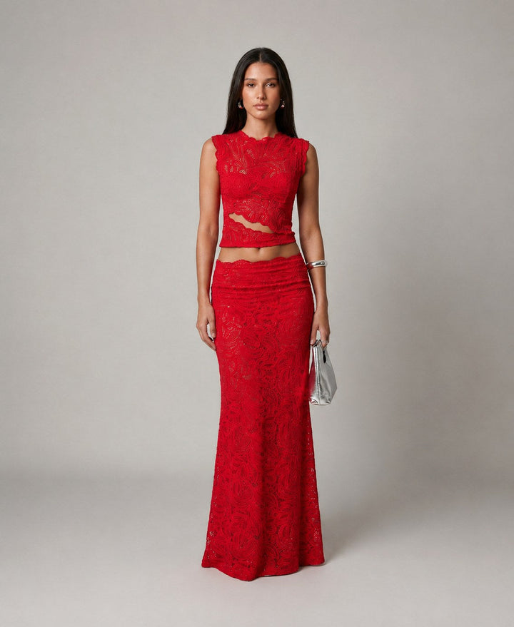 Women's elegant floral two-piece set featuring a sleeveless crop top and a flowing maxi skirt, perfect for evening wear.