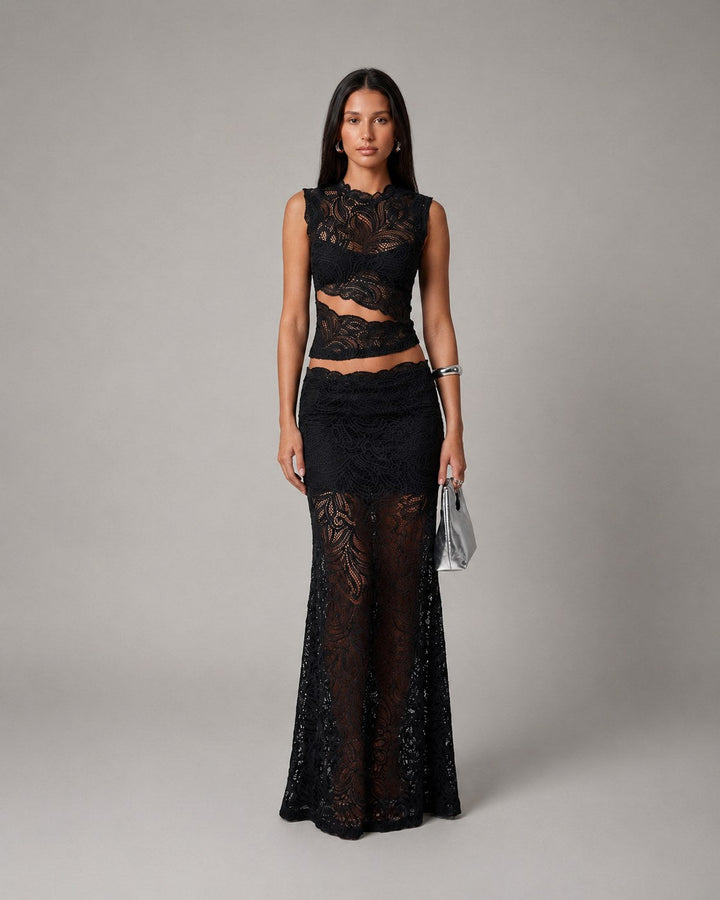 Flowy women's floral maxi skirt and sleeveless crop top set, an elegant two-piece for formal occasions or evening.
