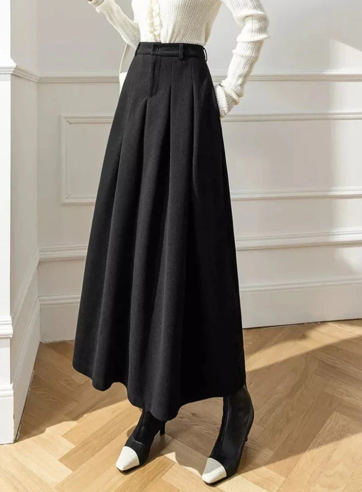 Cozy brown pleated A-line midi skirt, a fashionable and warm choice for women.