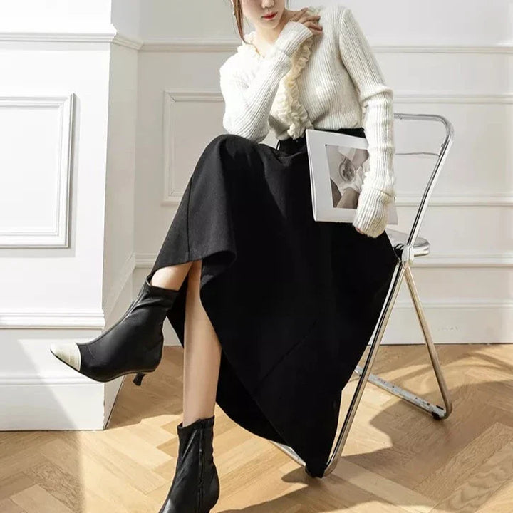 Flowy black pleated A-line midi skirt, a chic and cozy addition to women's winter wardrobe.