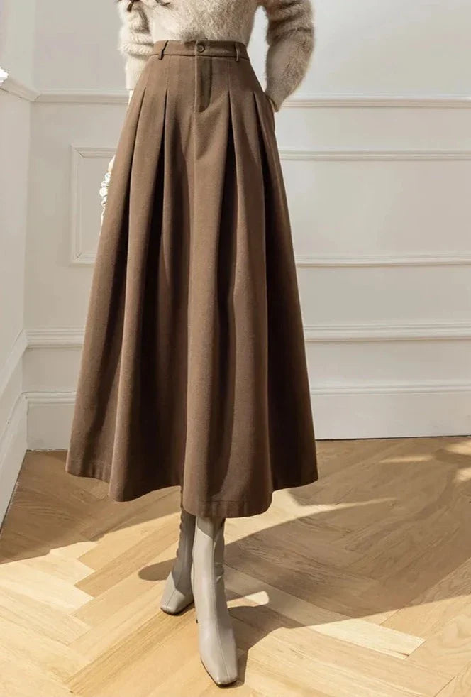 Elegant black pleated A-line midi skirt, a versatile piece for women's autumn fashion.