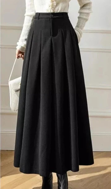 Women's flowy black A-line pleated skirt, a sophisticated and casual fashion choice.