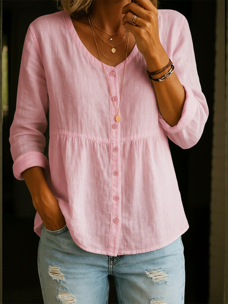 Elegant women's long sleeve button-down peplum tunic top, perfect for smart casual or everyday wear.