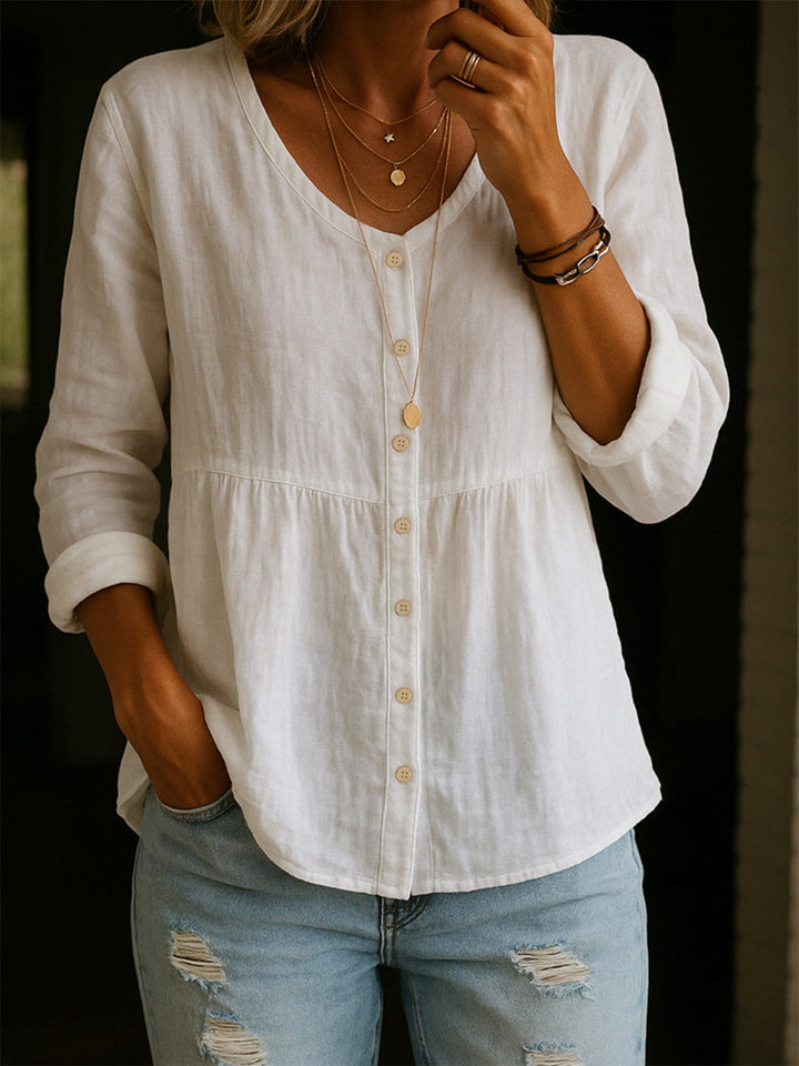 Smart casual women's peplum tunic top with button-down front, long sleeves, an elegant blouse.