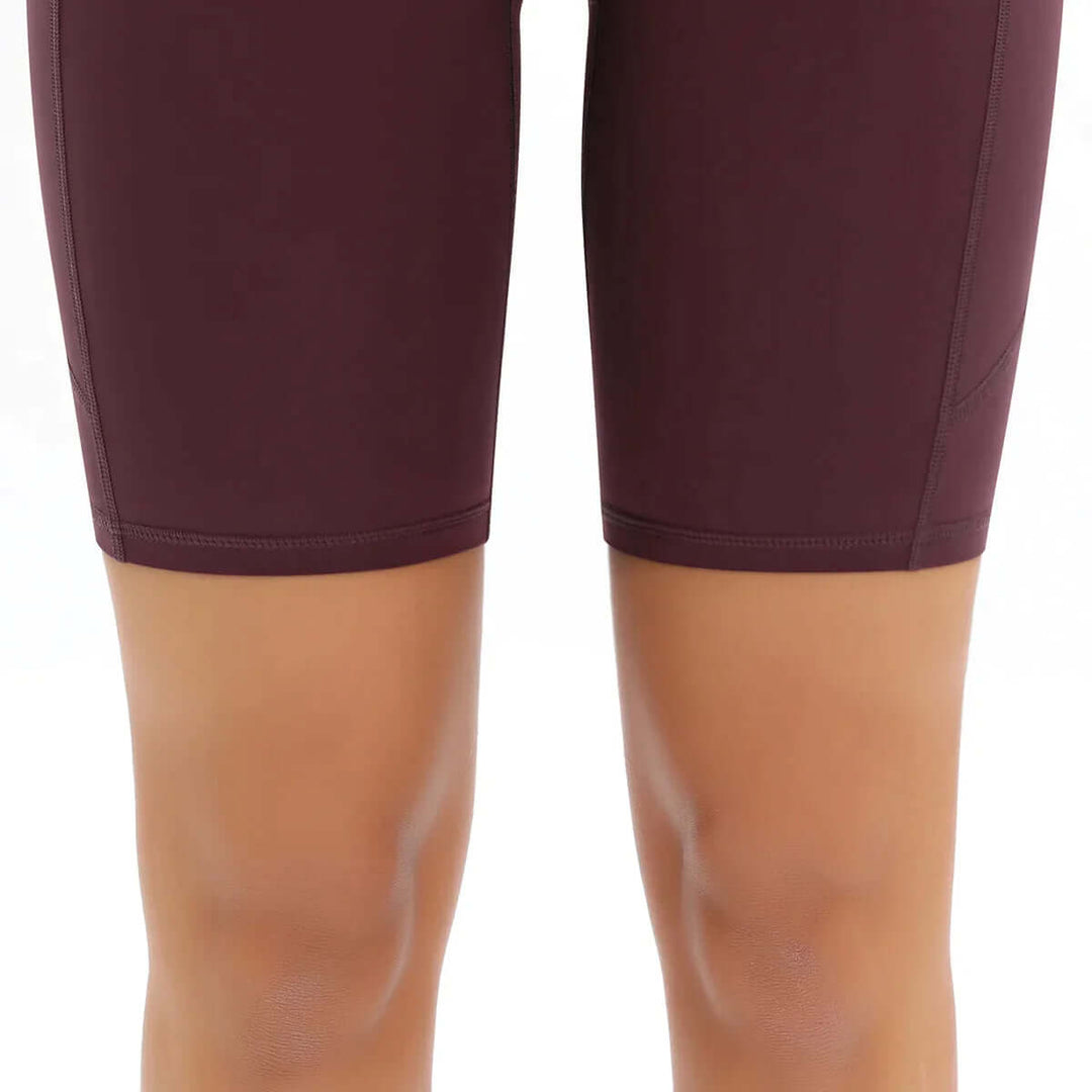 Essential women's high-waisted pocket bike shorts, gym-ready & stylish fitness apparel.
