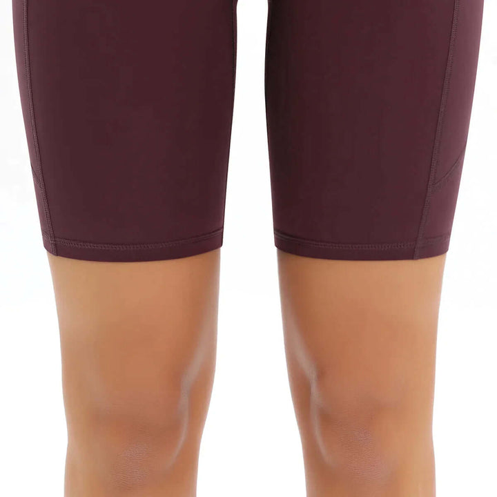 Essential women's high-waisted pocket bike shorts, gym-ready & stylish fitness apparel.