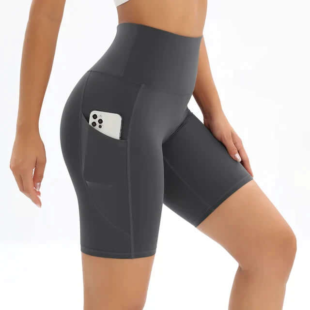 Women's comfortable high-waisted bike shorts with pockets, essential for sportswear & fitness.
