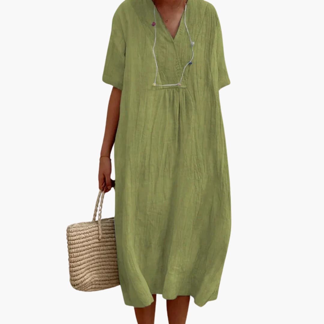 Chic women's relaxed fit V-neck midi dress, ideal for casual wear, offering comfort and refined style.
