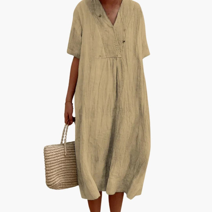 Breathable linen V-neck midi dress for women, featuring a relaxed fit, perfect for elegant summer days.