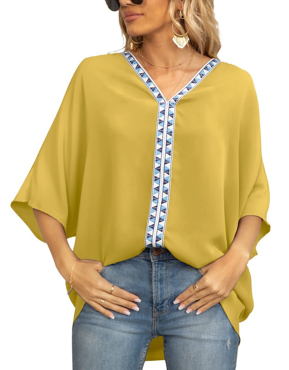 Elegant women's boho tunic featuring embroidered details, an oversized fit, and a high-low hem.