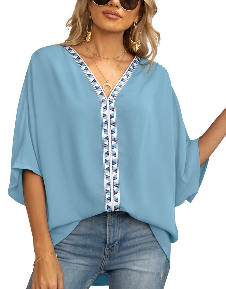 Ladies' spring/summer boho tunic with detailed embroidery, oversized fit, and V-neckline.