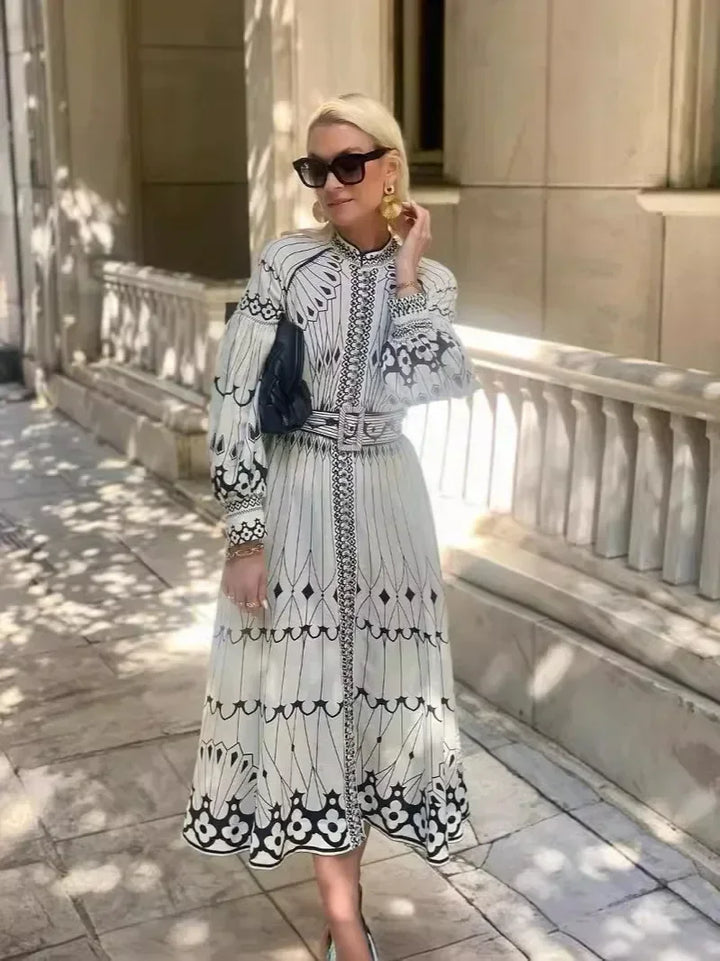 Timeless women's A-line midi dress with chic retro print. A sophisticated choice for daywear or special events.