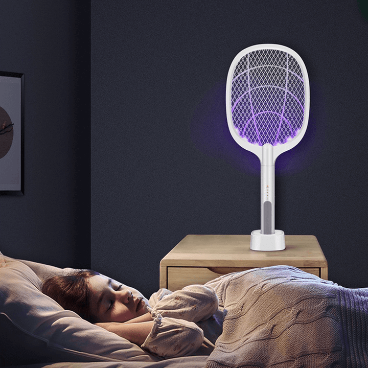 Safe handheld electric bug zapper racket with USB charging for mosquito, fly, & pest elimination.