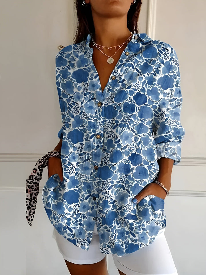 Close-up of elegant women's button-up blouse fabric, showing buttons & V-neck detail. Comfortable professional top.