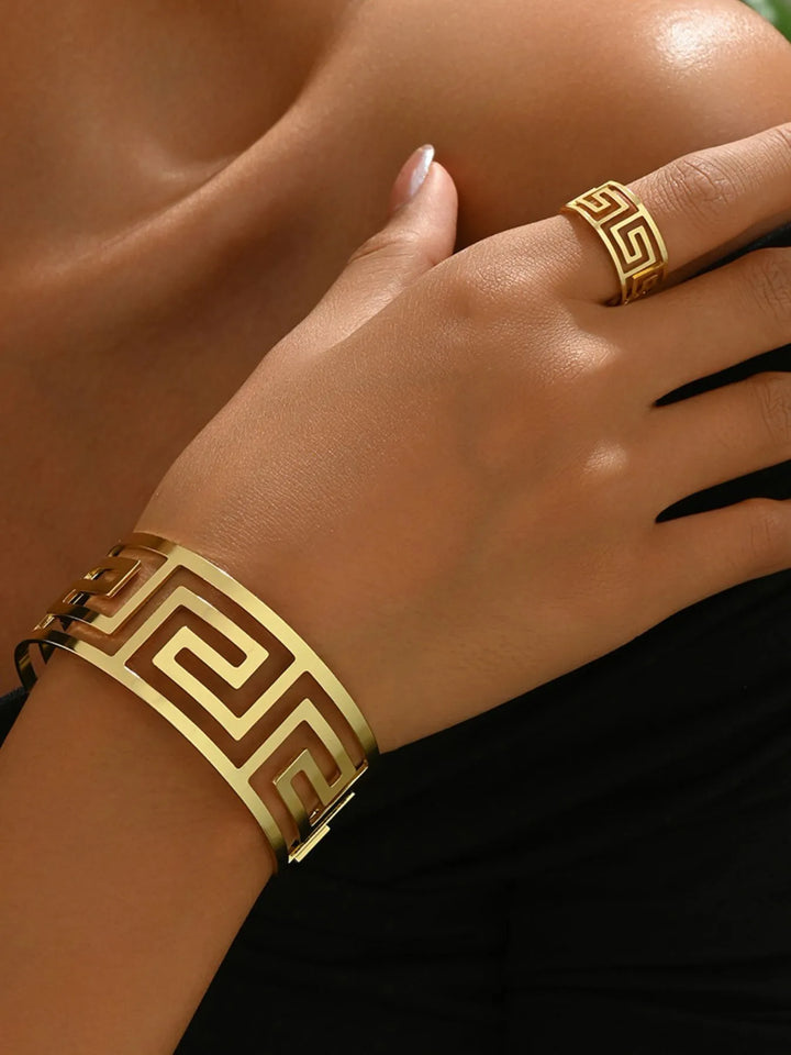 Fashionable women's jewelry set featuring a gold plated geometric bracelet and matching ring.