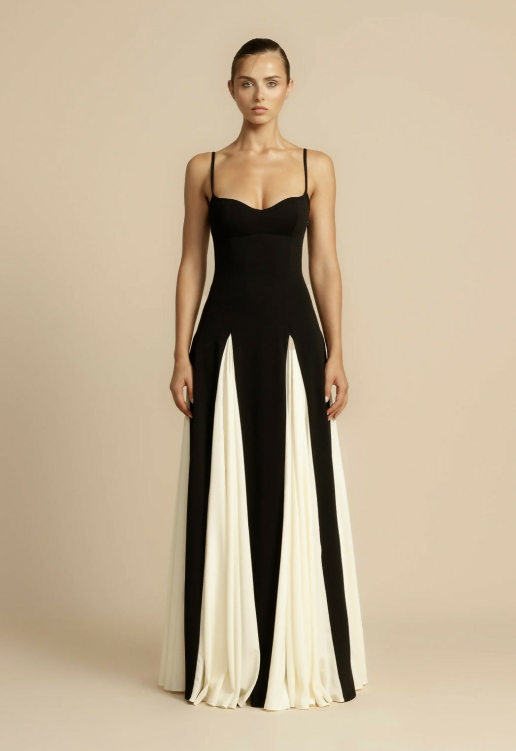 Full-length black A-line formal gown, sophisticated women's evening wear.