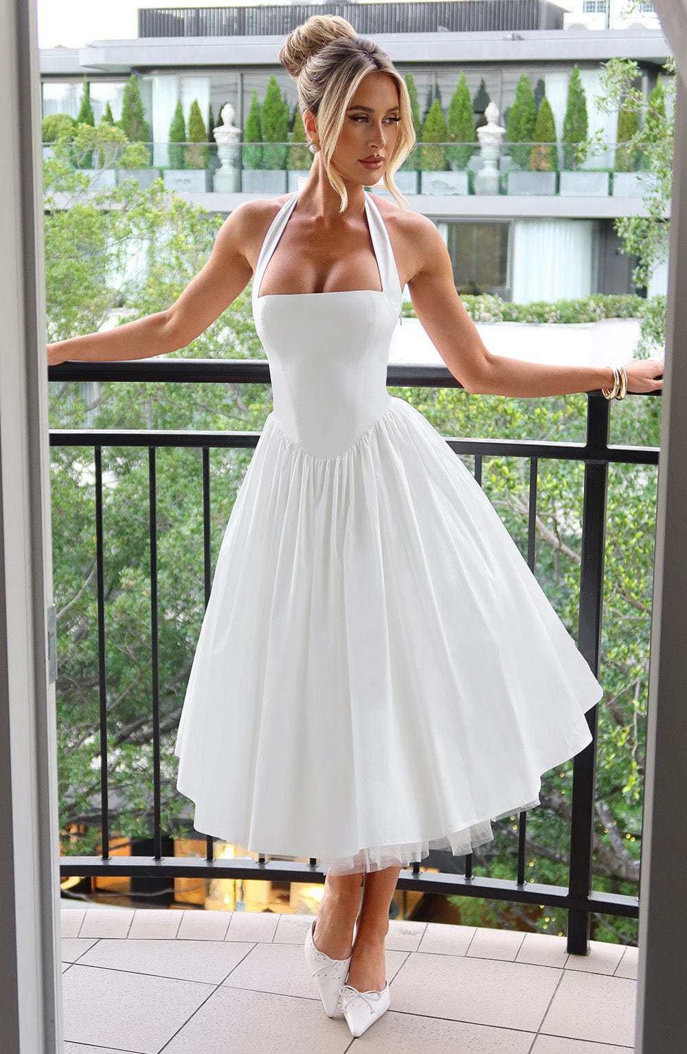Chic white halter neck midi dress, an ideal special occasion or evening dress.