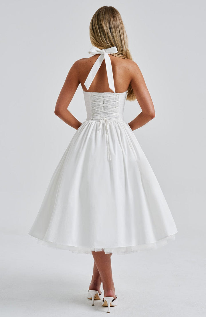 Versatile halter neck midi dress suitable for evening parties and summer occasions.