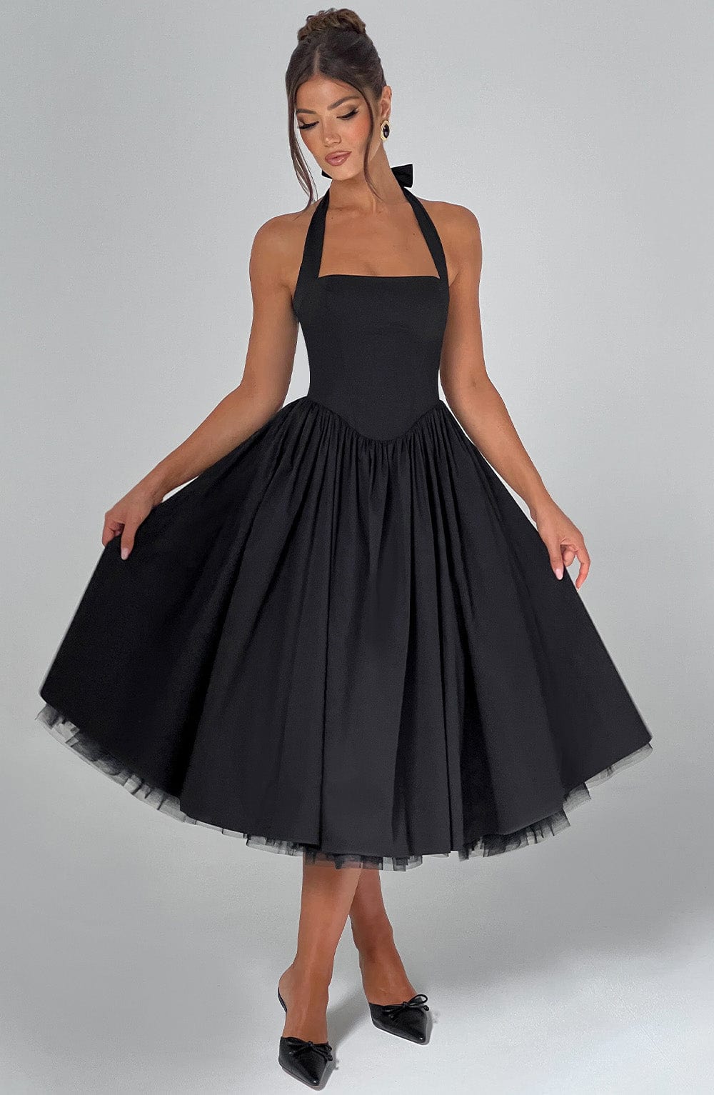 Stylish white halter neck dress, a perfect choice for weddings and celebrations.