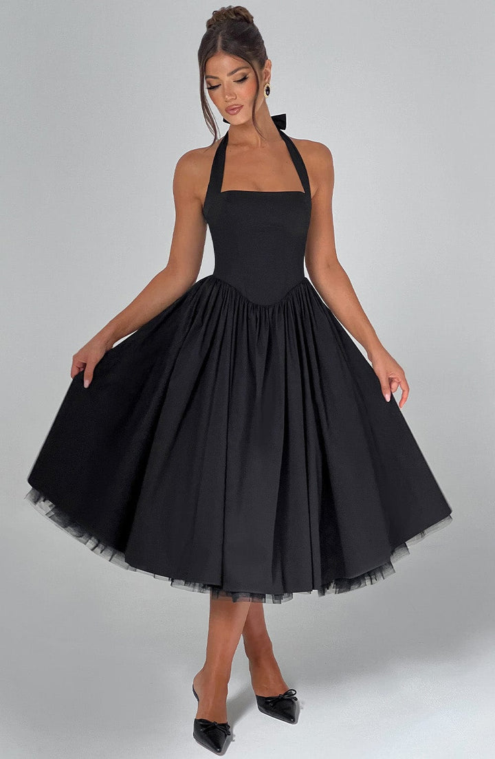 Stylish white halter neck dress, a perfect choice for weddings and celebrations.
