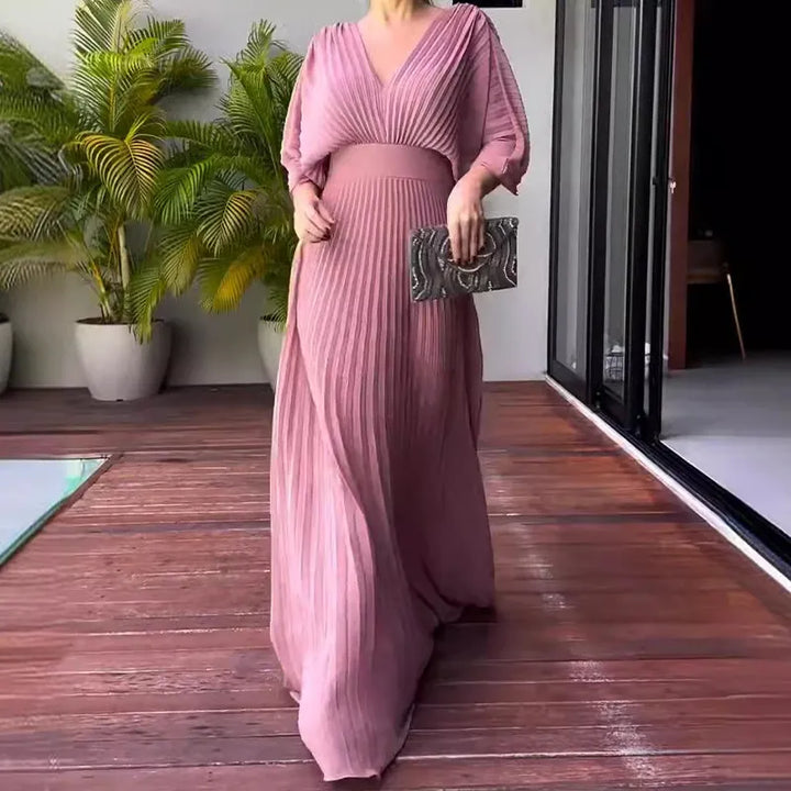 Perfect party dress: women's black pleated maxi with elegant cape sleeves.