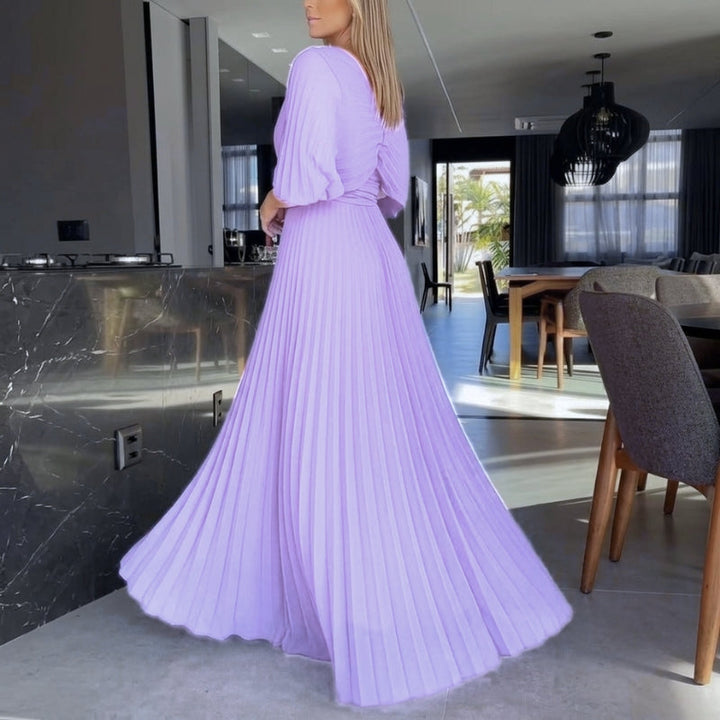 Women's flowing black evening gown featuring sophisticated cape sleeves and a pleated skirt.