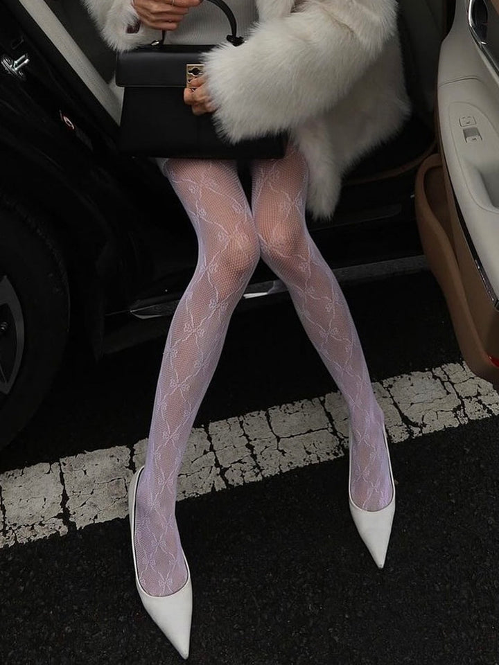 Comfortable sheer women's pantyhose with elegant bow pattern, perfect for sophisticated fashion & hosiery.