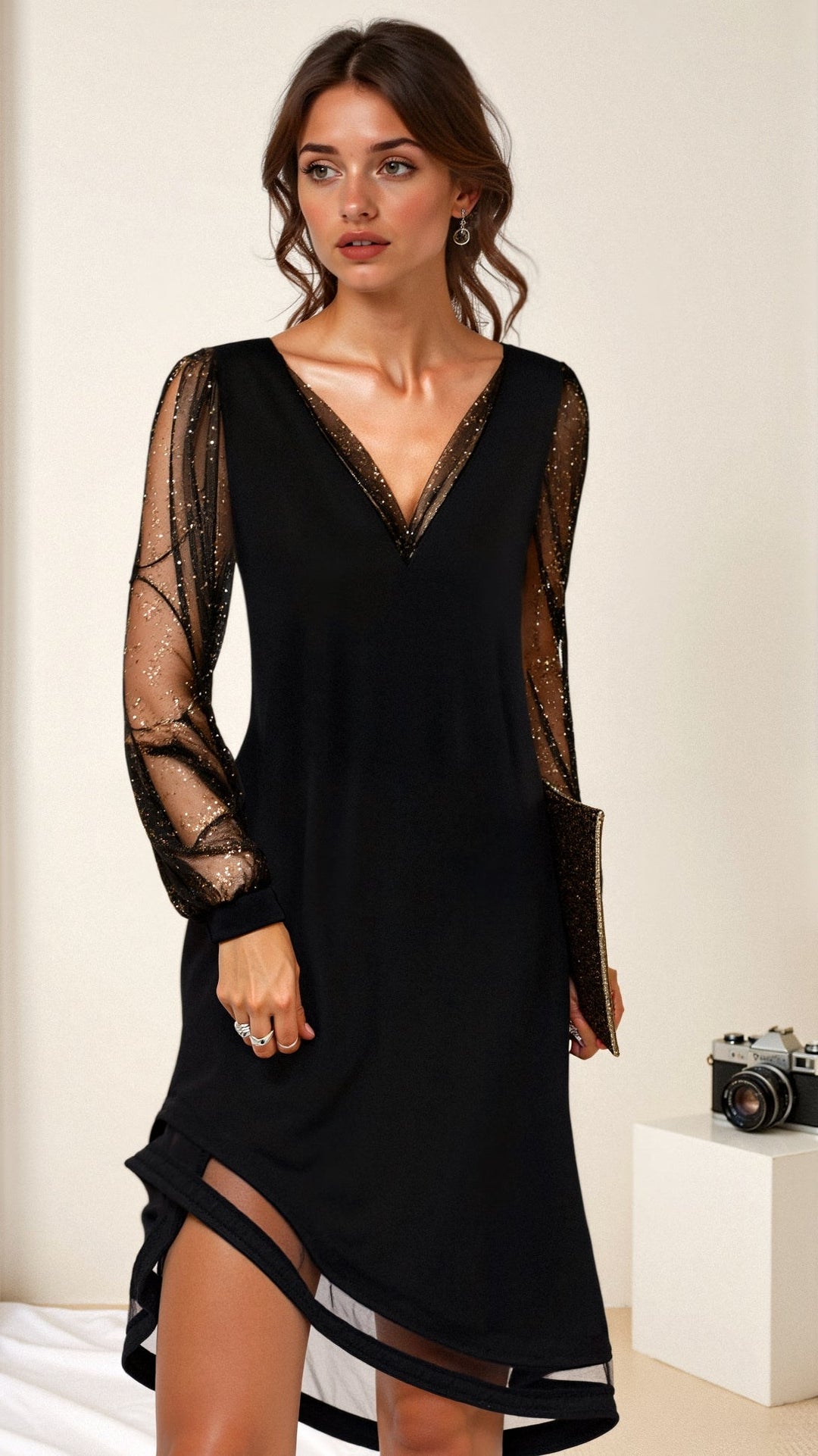 Stylish women's black cocktail mini dress with shimmer sleeves, ideal for evening events & special occasions.