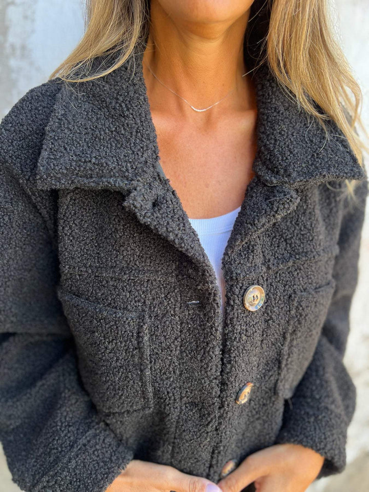 Elegant women's winter coat with button closure. Cozy & stylish outerwear, perfect for fall and winter fashion.