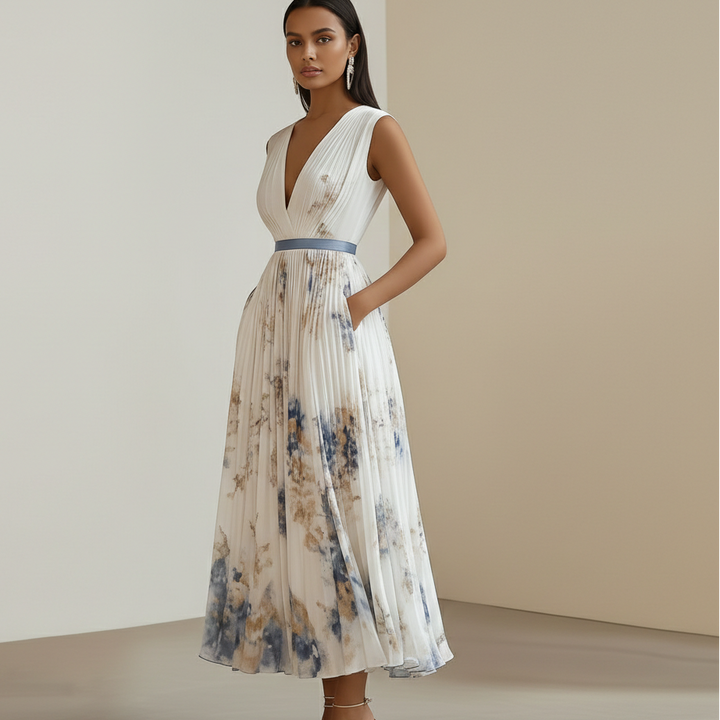 Women's V-neck pleated floral maxi dress in blue & white. Stylish occasion wear for formal events & parties.