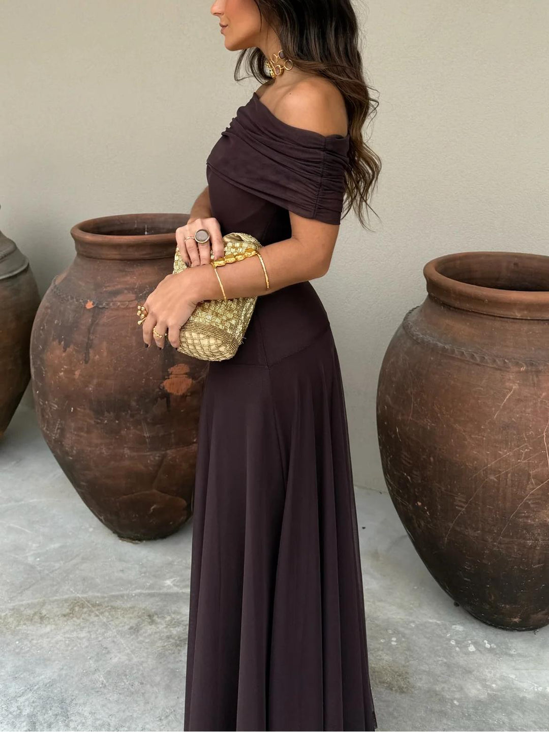 Women's elegant brown chiffon maxi dress with off-shoulder design, wedding guest style.