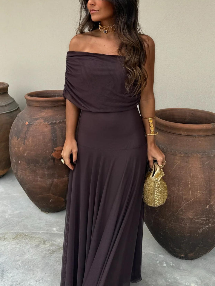 Flowy and fashionable women's brown chiffon maxi dress with off-shoulder detail.