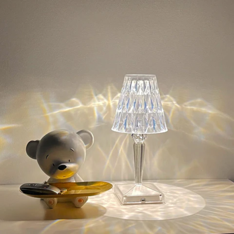 Bright crystal table lamp, providing chic and modern lighting for living room ambiance.