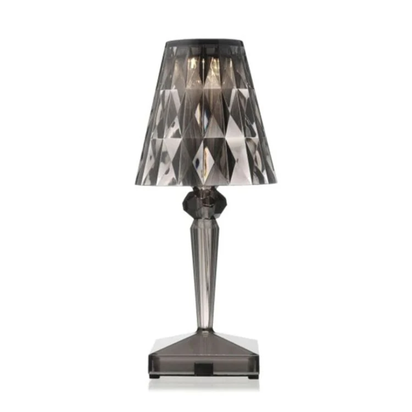 Close-up of glittering crystals on an elegant table lamp, luxurious accent lighting.