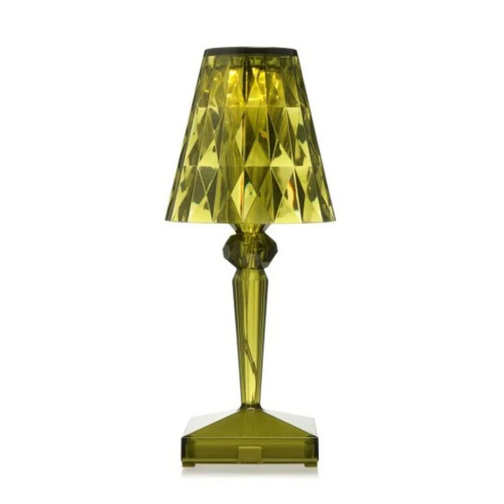 CrystalLuxe table lamp illuminating a living room, providing warm and modern lighting.