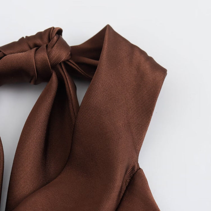 Simple yet elegant brown halter midi dress for women, a sophisticated choice for evening party wear and events.
