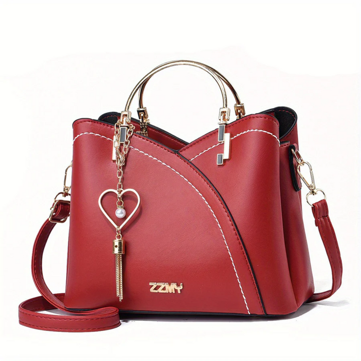 Side view of chic faux leather handbag, ample space for women's essentials.