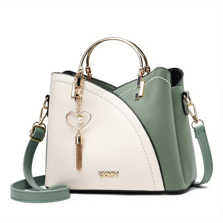 Woman carrying elegant faux leather shoulder bag, a perfect fashion accessory.