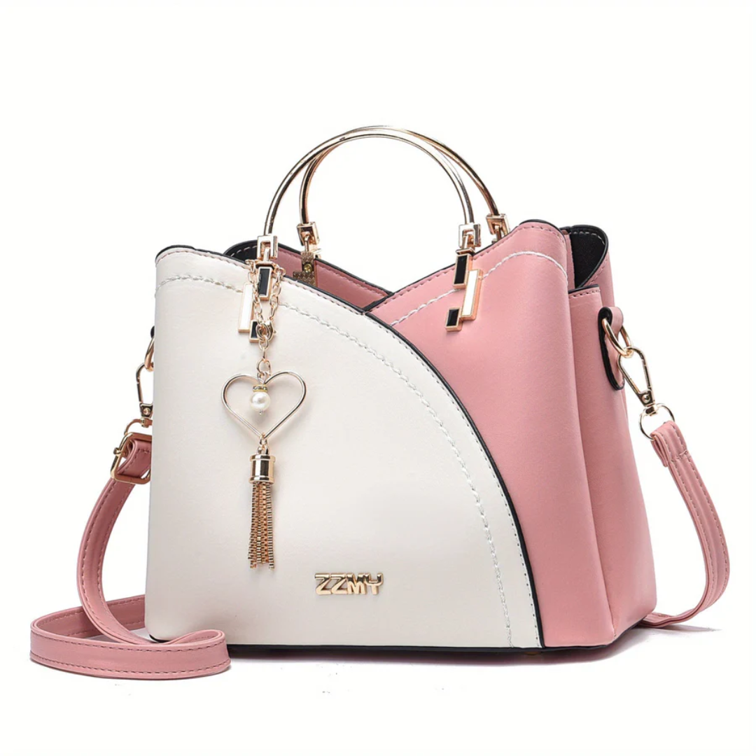 Flat lay: Chic faux leather handbag on surface, essential women's daily bag.