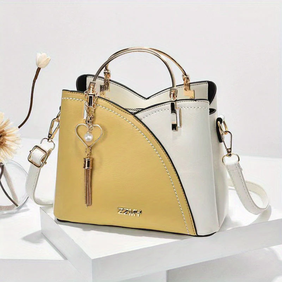 Elegant women's faux leather tote bag with long adjustable shoulder strap.