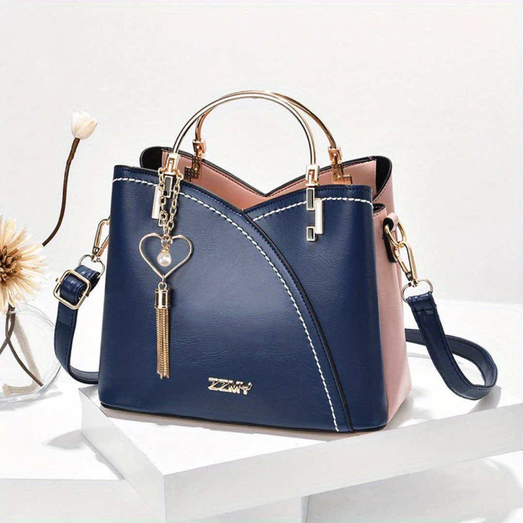 Fashionable women's faux leather bag, versatile for office to evening.